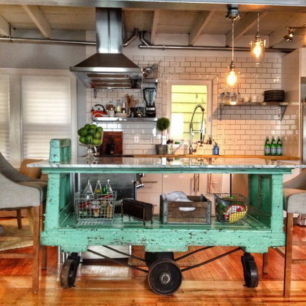 Vintage factory car. The moving green vintage island here is absolutely a great way to open up the whole room. And the cast is really a separate serving room where you can chat with drinks.