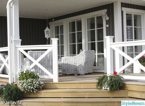    Deck in natural colors and the white X-shaped railing. Stylish X-shaped decorations are becoming increasingly popular these days. Fantastic white X-shaped rails give the deck a delicate, individual look in natural colors.  