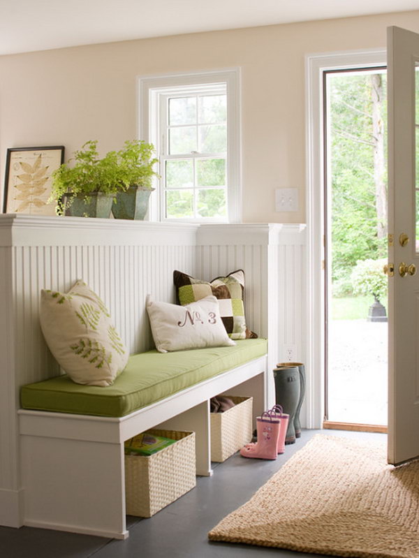     Bright and cozy. What a fresh, comfortable and inviting mud room. Green plants and green bench ecco green trees outdoors. I love white woodwork. Really clever room separation that adds additional functionality and makes the small room appear larger. A nice way to make a foyer. 