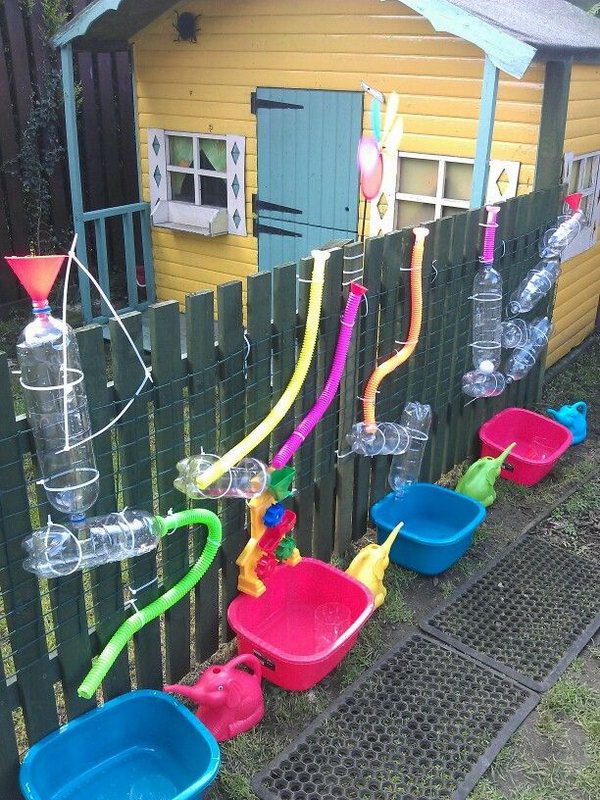     Keep your little ones busy. Ideal for fun in warmer weather. Staple PVC bottles and pipes to a wooden post. Add water, have fun! 