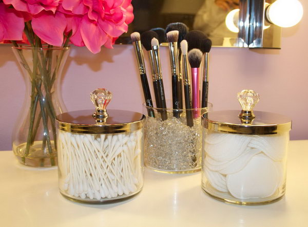 DIY makeup brush holder from empty candle glasses. What a super easy project for your makeup storage.