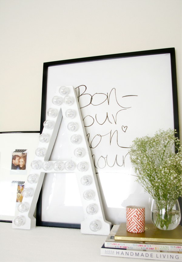 DIY marquee letter. Cut the letter out of the box, cut an asterisk to push the lightbulb, and turn the lights into position to stow away excess cable. It serves as a fashionable decor for your dormitory and also provides elegant lighting for girls.