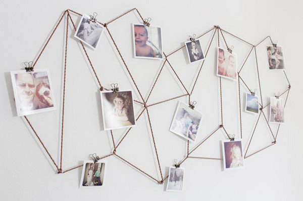 DIY geometric photo display. Use a bronze jewelry cord to create a stunning background for all of your photos. Use small tie clips to attach all of your pictures. It's great to decorate your dorm in this fantastic geometric decor and show off your sweet memories.