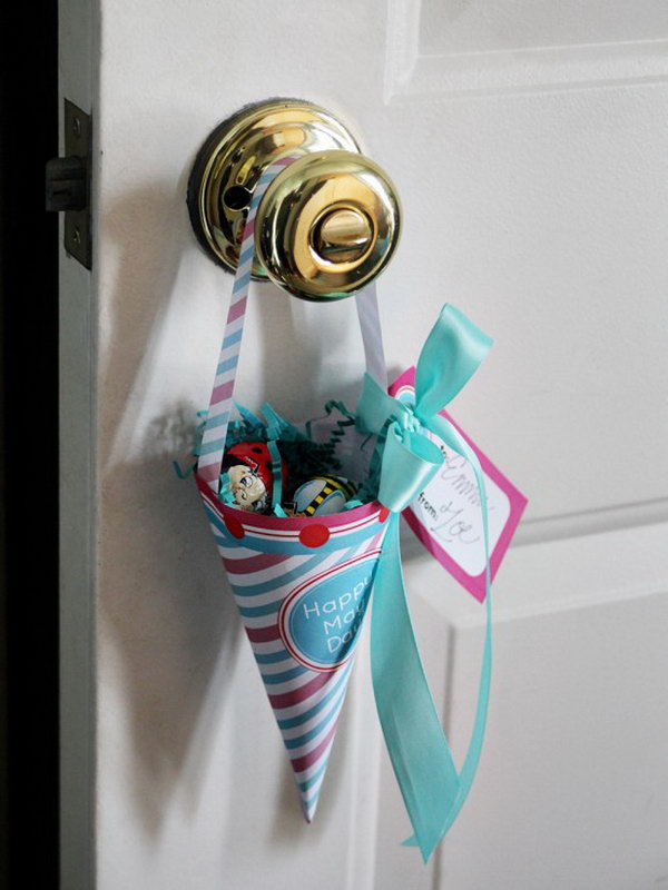 Merry May cone. Use a craft paper base and use spun cotton mushroom, velvet flower, paper flower, vintage buttons, flower butterflies, and ribbons to create this spring offer hanging on the doorknobs of friends in the flower-filled basket shape for a fresh spring look.