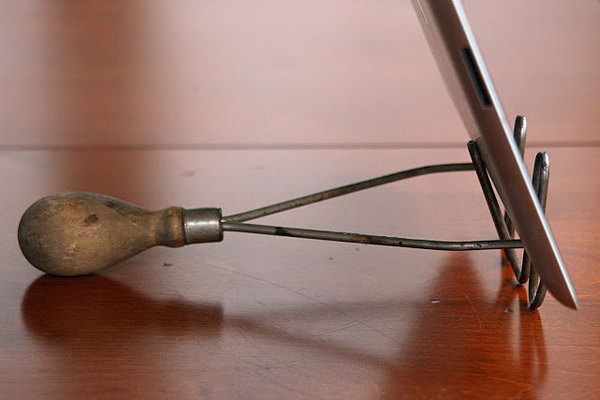 DIY iPad stand out from vintage potato masher. Simply bend the middle loop on the tamper back to the handle. This simple iPad stand is great in the kitchen to view recipes or read your favorite blog.