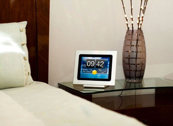If you have a photo frame in your living room table, you can easily replace the photo frame with your iPad. 