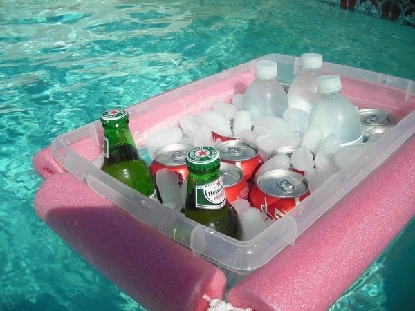 DIY floating bar. Cooling off for the summer party with this floating DIY bar with beer, cocoa cola, soda and ice cubes to enjoy the cool taste and float along the clear water.