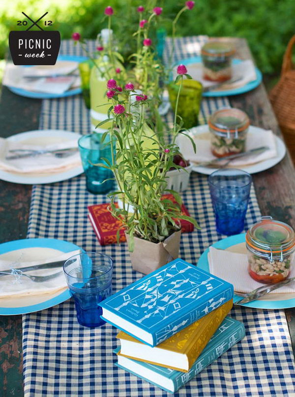 Vintage summer party table setting. Cover the plastic base with craft paper, display mason jars and flower plants to add color and find the right balance between pretty, special, and no-frills.
