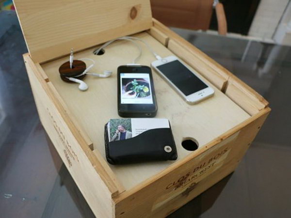 Wine box charging station. Use a favorite container, like a wine box, to create a storage unit where all your devices are organized and tucked away in a neat room.