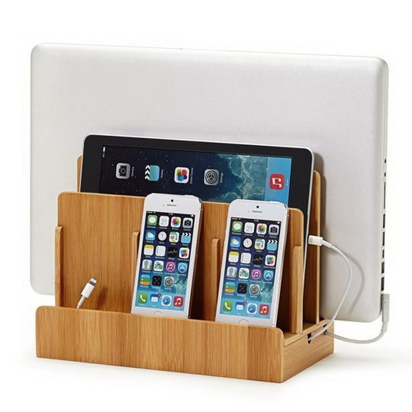     Bamboo charging station for multiple devices. This storage unit is perfect for organizing your device well. This bamboo multi device can also serve as a wonderful thing to light up your decor.