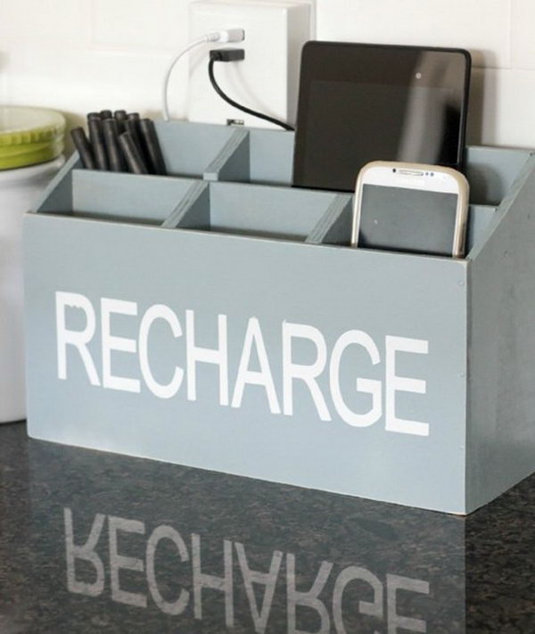 DIY charging station. Cut wooden boards, assemble and fasten with nails, spray white enamel on the charging station. It's fantastic to put all of your devices on the counter without looking like clutter.