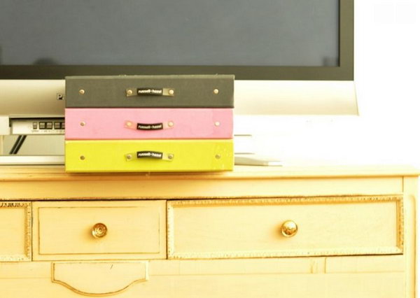 Useful boxes to keep things organized. Invest in affordable storage containers to avoid the mess of DVDs, CDs and paperwork for electronics. A simple storage box can transform your room decor into a neat and clean style.