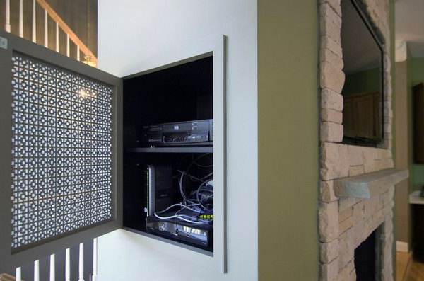 Organization for hanging wall electronics. Install an organization system to keep the space clean. This hidden niche is perfect for storing components for a wall television with a contractor's design.