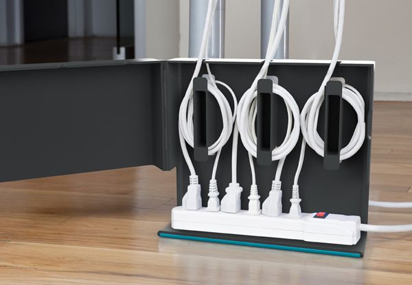 Plug Hub Cable Organizer. This creative device serves as a cable wrap to avoid additional cables and simply throw your cables in in a super chic living style. It even allows you to hide a full power strip.