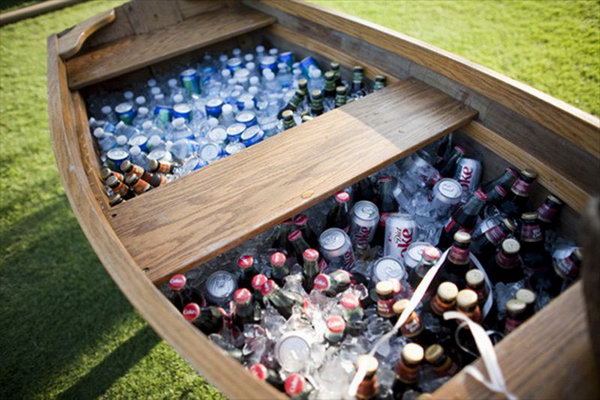 Mammoth boat beverage station. Rent a vintage boat and fill it with tons of ice cream and drinks to give your guests a wonderful welcome. This is also perfect for a rustic beverage station design.