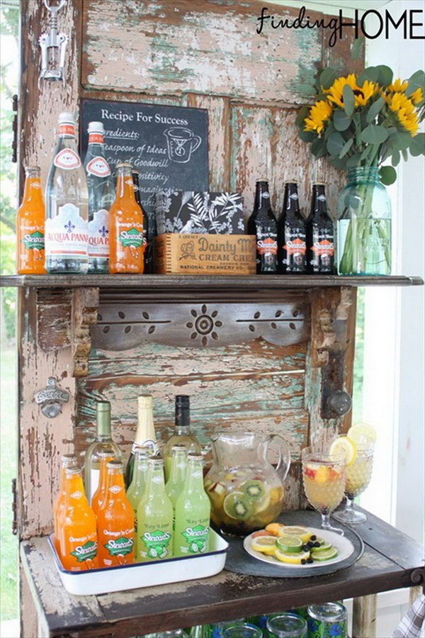 Vintage door drinks bar station. This idea works perfectly with limited space to serve drinks for the whole crowd.