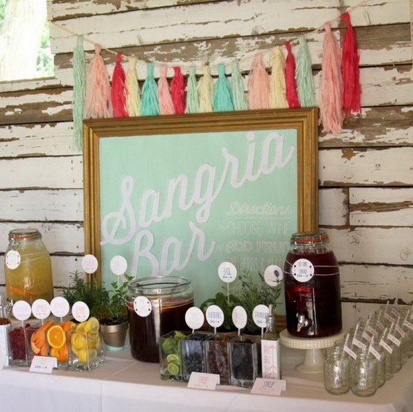 Sangria beverage station. Beverage stations are a great way to offer your guests tasty drinks in addition to the usual wine and juice. Add a sign to draw attention to your sangria bar. The sign fits the theme of this beverage station perfectly.
