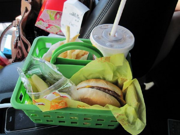 You can buy a cheap basket as a food holder in the car so your kids can prevent food from spilling over your car. This organizer also has three compartments so that everything has space for your convenience. 