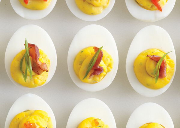 Bacon Deviled Eggs. Drain the boiled eggs, remove the egg yolks, crush the reserved egg yolks, bacon fat, mayonnaise, mustard, spring onions and season with salt and pepper to give your guests a delicious taste after the exciting party events. 