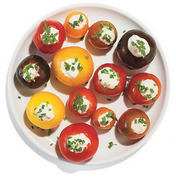 Cherry tomatoes stuffed with horseradish. Scoop out the center of the cherry tomatoes with a small knife and sprinkle the mayonnaise with horseradish. Top it with fresh herbs to present a nice view. It is super chic to serve your guests this dinner party meal. 