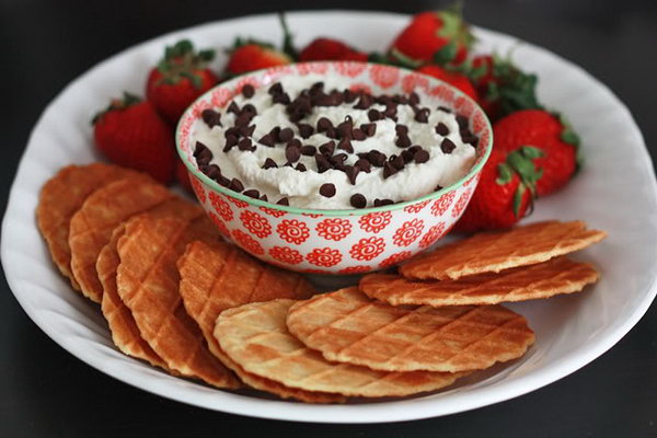 Cannoli dip. Mix ricotta, yogurt, sugar, vanilla. Fold in pieces of chocolate and pour some sprinkles over them. Put them in an arc. Serve this with sweet cookies and strawberries to spoil your guests. 