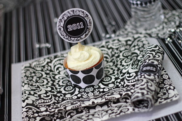 Black and white graduation ceremony. Create this fabulous graduation party collection in honor of the graduate's accomplishments with black and white damask plates and napkins, and brush stroke cupcake packaging. 
