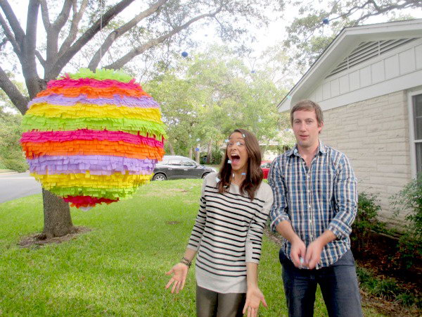 Surprise Lantern Gender Reveal Party. Stand under your giant pinata to divide the countdown announcement and detach the pinata from the tree as it falls into the grass. The confetti, either pink or blue, flows out to share the big news.