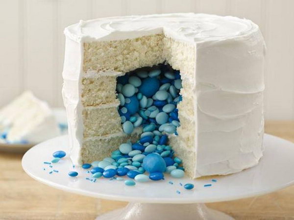 Gender Reveal Cake. Bake a gender reveal cake with a cascade of sweets of the appropriate color to bring the exciting news to all your friends and family members.