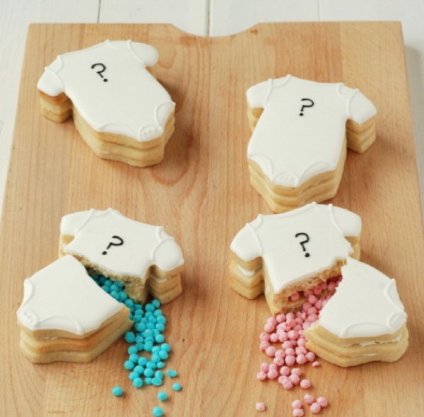 Gender Reveal Cookies. So many people are trying to make cakes to make the announcement. Try something new by baking some stunning cookies with lots of little candy to make the announcement.