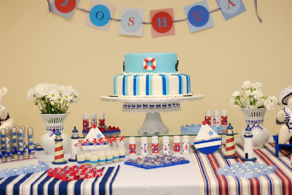 This very modern and clean nautical themed party is rich in details. The little decorations like anchors, oars, sails and lighthouses are so cool.