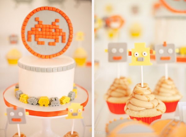 This cheerful yellow, orange and gray space invaders birthday party was deeply impressive. Even the flower arrangements have antennas! And they were so cute.