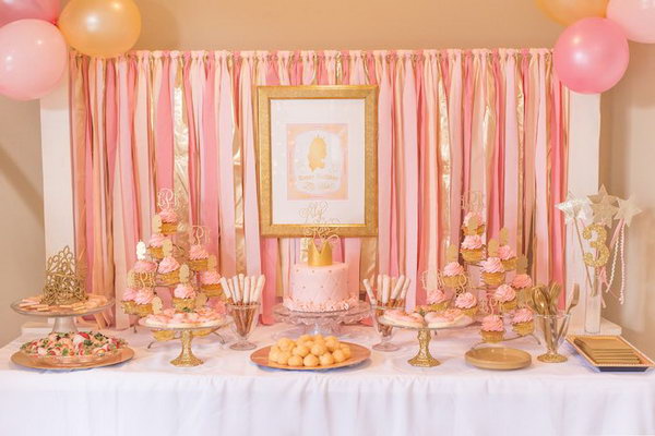 Pink and gold princess party idea. This fabulous princess party consists of pink cupcakes with a golden silhouette topper, pink cakes with a golden crown, pink and shimmering gold ribbon background, fabulous stands, trays and glittering golden plate bases. Every princess must be impressed by these sweet and shimmering gold accents and elegant pieces.