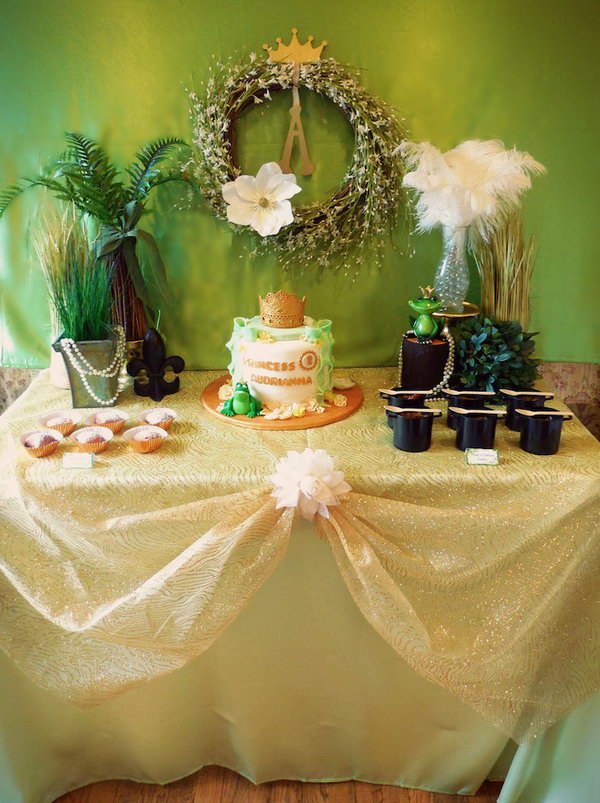 Princess and the frog party. This princess and the frog party consist of gold princess crown cake topper, marsh water punch, chocolate party favors and frog-shaped decorated mugs. The beautiful party is full of wonderful ideas that fit this topic.