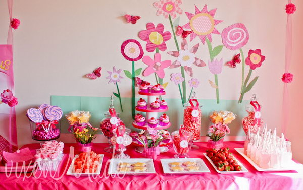 Pinkalicious party. I really appreciate the cute floral pattern background. The dessert table consists of lollipops, star stick sugar cookies, pretzels coated with pink candy and various fruits. It's so great to plan and share with your adorable princess.