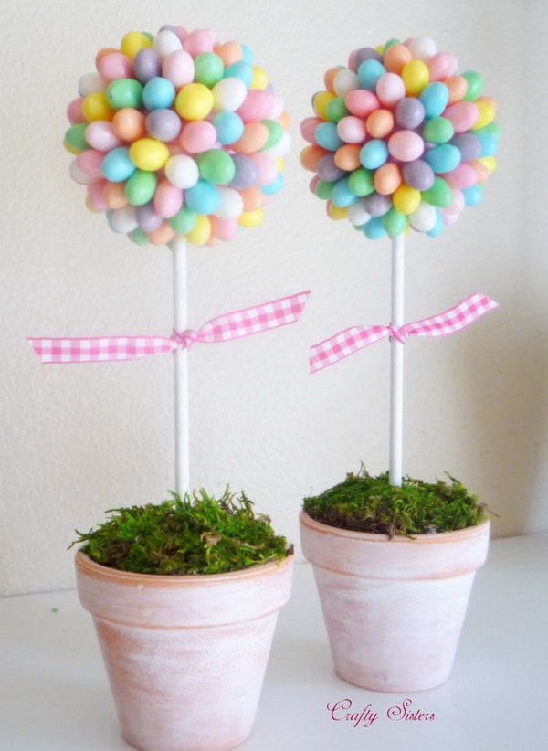 Jelly Bean Topiary. This sweet and romantic jelly bean topiary gives your Easter decoration a fresh spring taste. Glue each jelly bean onto a pink styrofoam ball. Add floral foam to anchor the dowel and cover it with moss.
