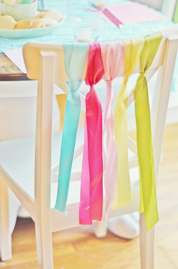 Tie the ribbon to the backrests of the chairs. It's a simple yet effective way to decorate dining chairs for your Easter spring celebration. 