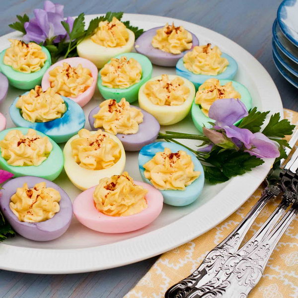 Delicious and colorful Easter eggs. It's an easy way to turn your devilish egg recipe for Easter. These rainbow colored devil eggs are an amazingly healthy alternative to traditional devil eggs. 