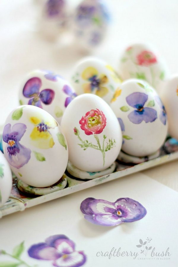 DIY watercolor Easter eggs. Show off the sweet seasonal look by simply painting some colorful flowers for the adorable eggs. Do these spring inspirations with your imagination.
