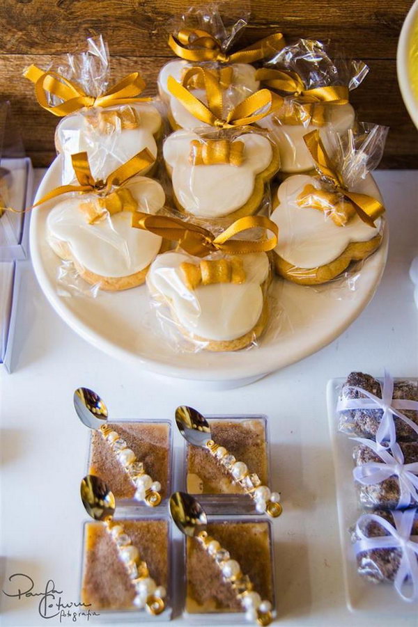 Wow, this party is spectacular! I am crazy about the color palette in gold and black. What makes this party different and fun is the amazing desserts and sweets. Look, they're shaped Mickey and Minnie Mouse. Your children can't wait to eat them.