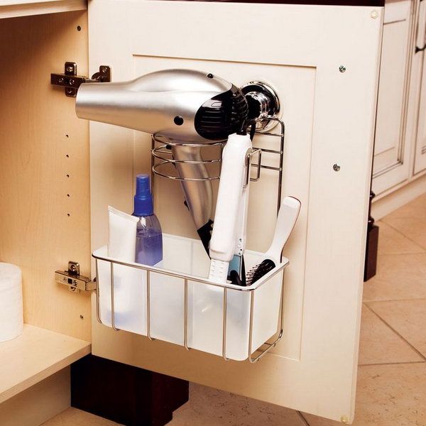 Cupboard door storage under the sink. Install a bracket over the cabinet door to store the hair dryer. 