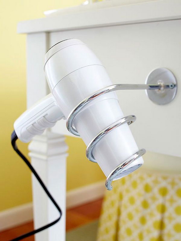 Blow dryer holster. Install a spiral holder for your hair dryer on the side of the washbasin. Use it as a cooling station after using the dryer.  