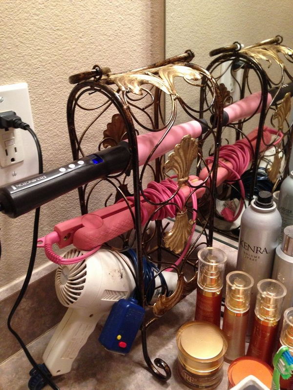 Wine rack hair dryer holder. Use a small and decorative wine rack to store your hair tools. It helps to keep the bathroom counters clean and beautiful. 