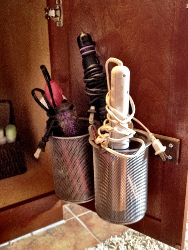 Office pen holder for heaters. Install these large pencil cups on the inside of the cabinet door. It is a great storage option for curling irons. 