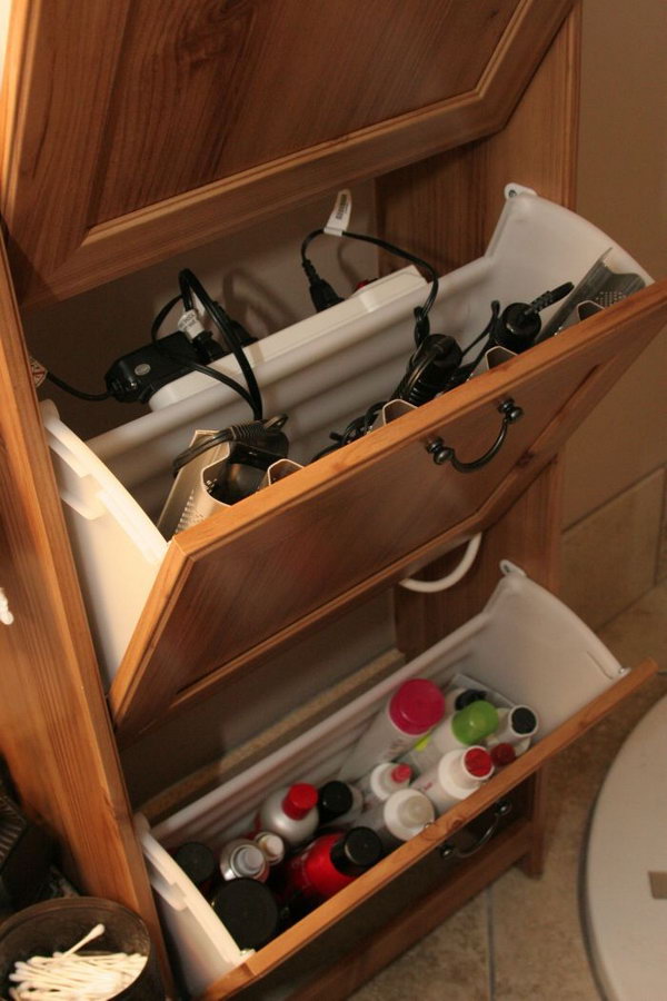 Use an Ikea shoe cabinet to store your curling irons, hair dryer, and power strip. 