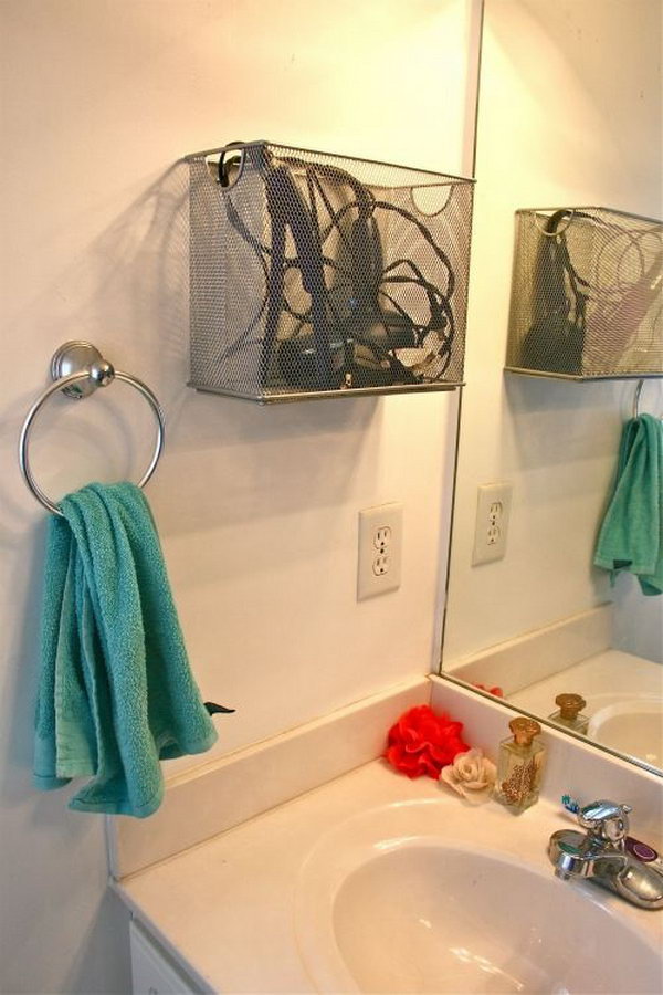 File box storage. Install a metal desktop file box on the bathroom wall to store your cooling hair dryer and straightener. It keeps things within reach and is comfortable enough to get what you need in the morning. 