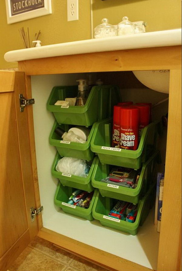 Stacking plastic containers under bathroom cabinet. These stacking containers from the Dollar Tree are very easy to stack vertically. You can even clearly see what's in the containers without marking these organizers. 