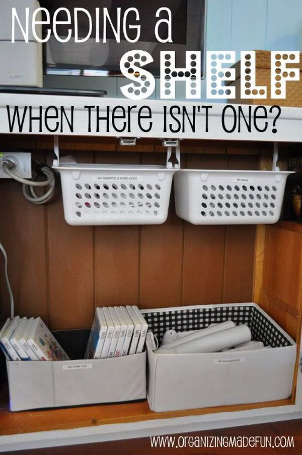 Store movie DVDs, toys, and books under the sink for extra storage. Hang the plastic baskets on the pipe or just use some cardboard boxes for storage. 