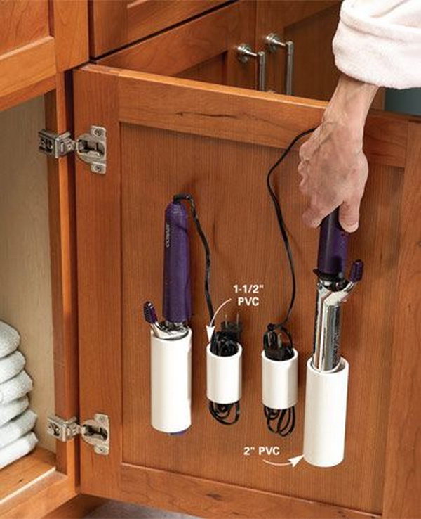 PVC pipe storage for curling irons and cords. Use the space above the vanity cabinet door for storage. Avoid the messy look of curling irons lying on the vanity or the toilet tank. 