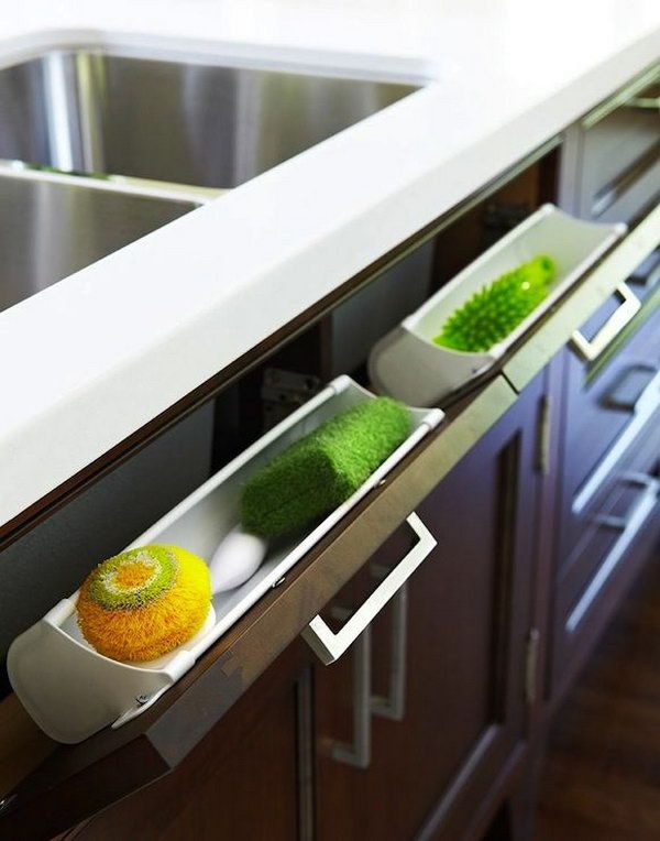 Under kitchen sink storage. Use a hidden pull-out panel under the sink to store sponges and accessories. 