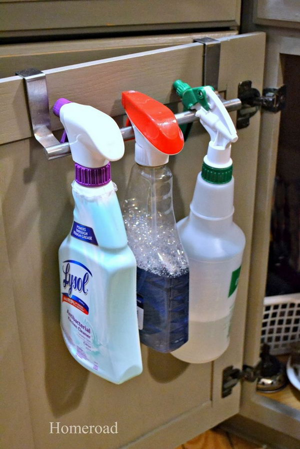 Towel rack over the closet. Hang your detergents over the towel rail of the cabinet door and make room under the sink. 